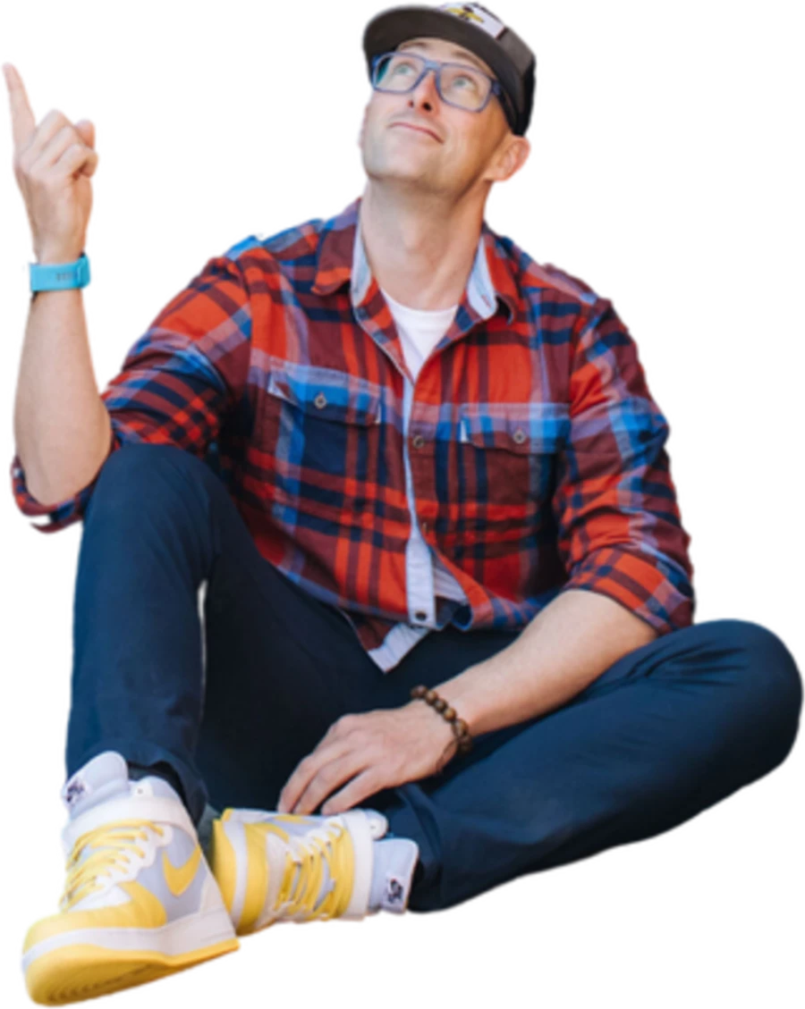 Steve sitting, pointing up mid-idea.